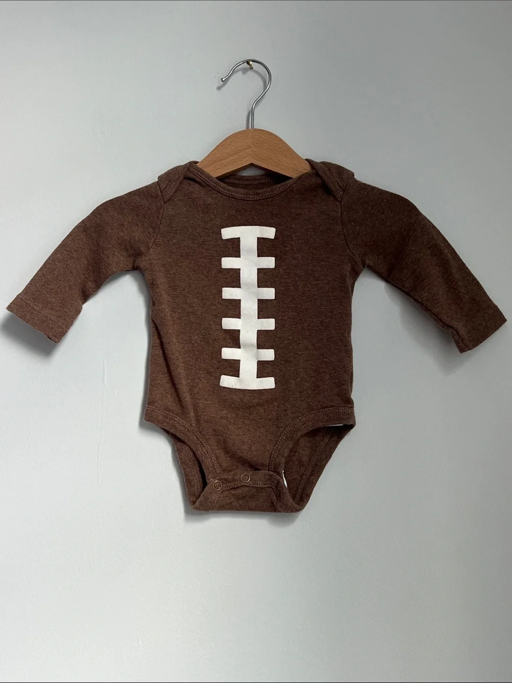 Carter’s | Brown Football-Stitch Long-Sleeve Baby One-Piece Size 3 Months